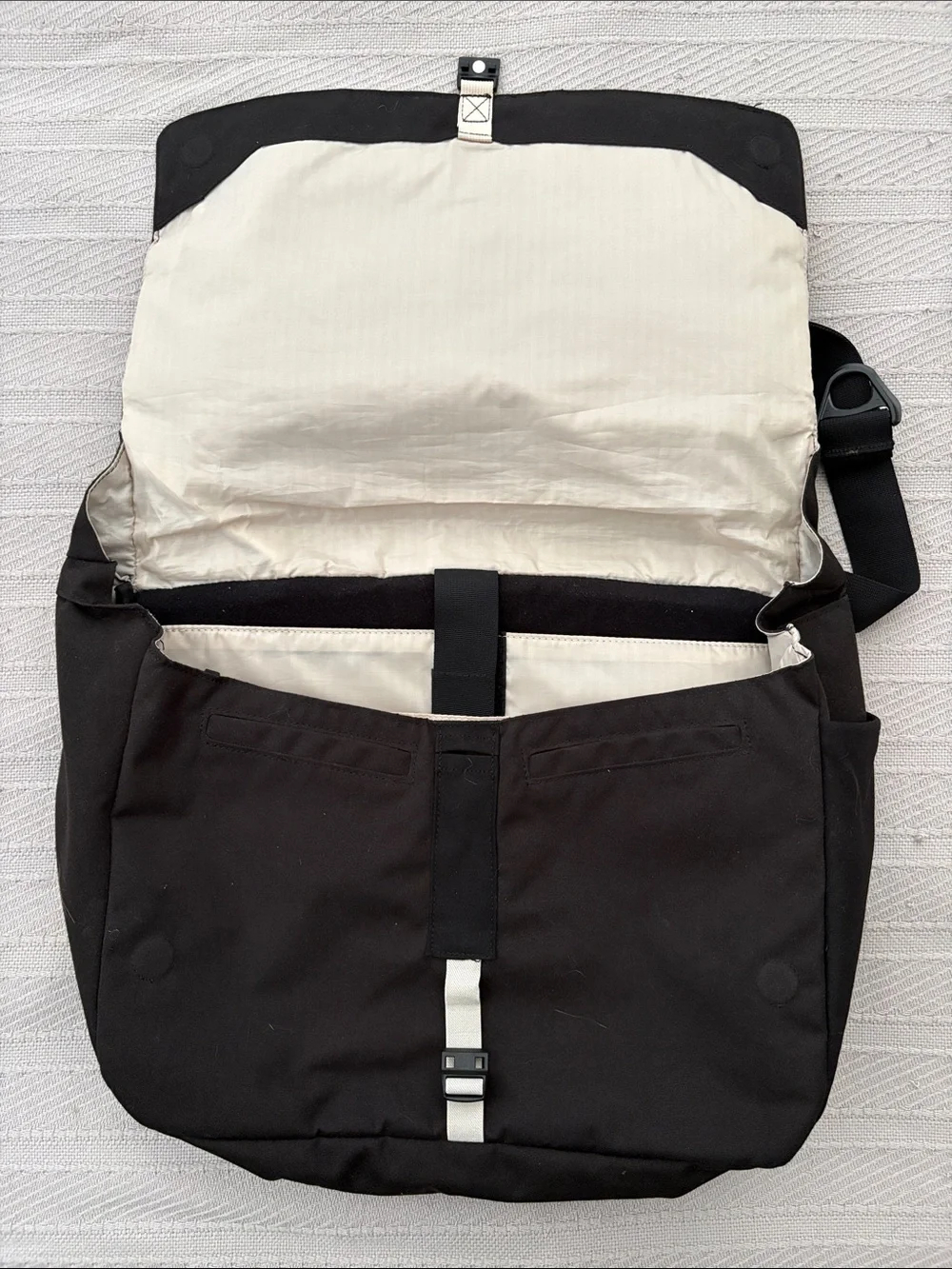 cotopaxi Black Messenger Bag with Cream Stripe